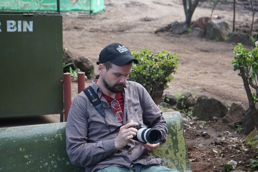 Photographer reviewing camera equipment